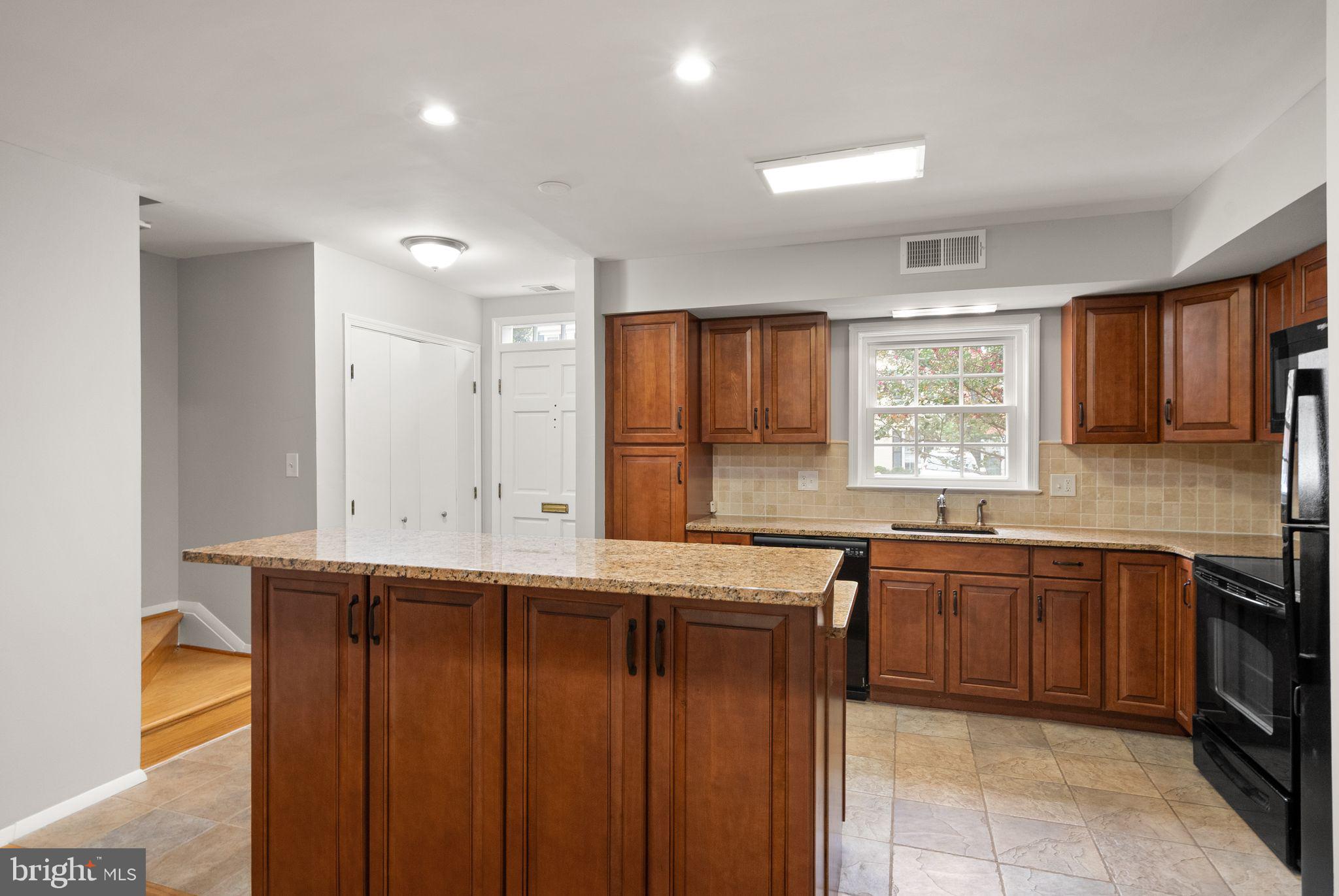 6611 Burlington Place Springfield, VA 22152 - Photo 4 of 41 a kitchen with lots of counter top space sink and a window