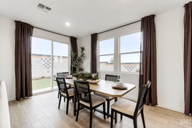 a view of a dining room with furniture and window