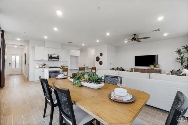 a kitchen with a dining table and chairs in it