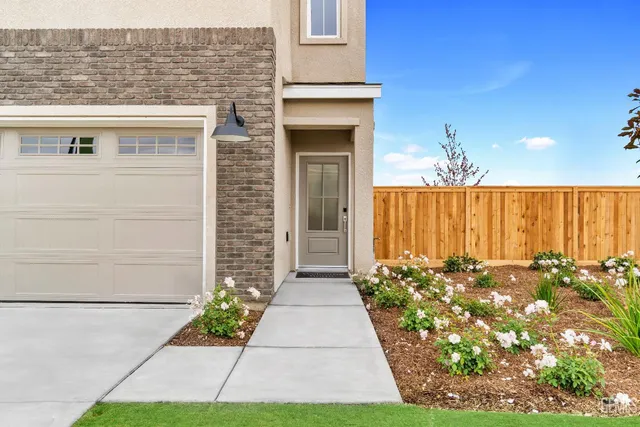a front view of a house with a garage