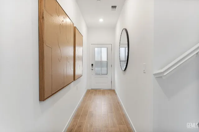 a view of a bathroom with a glass door shower