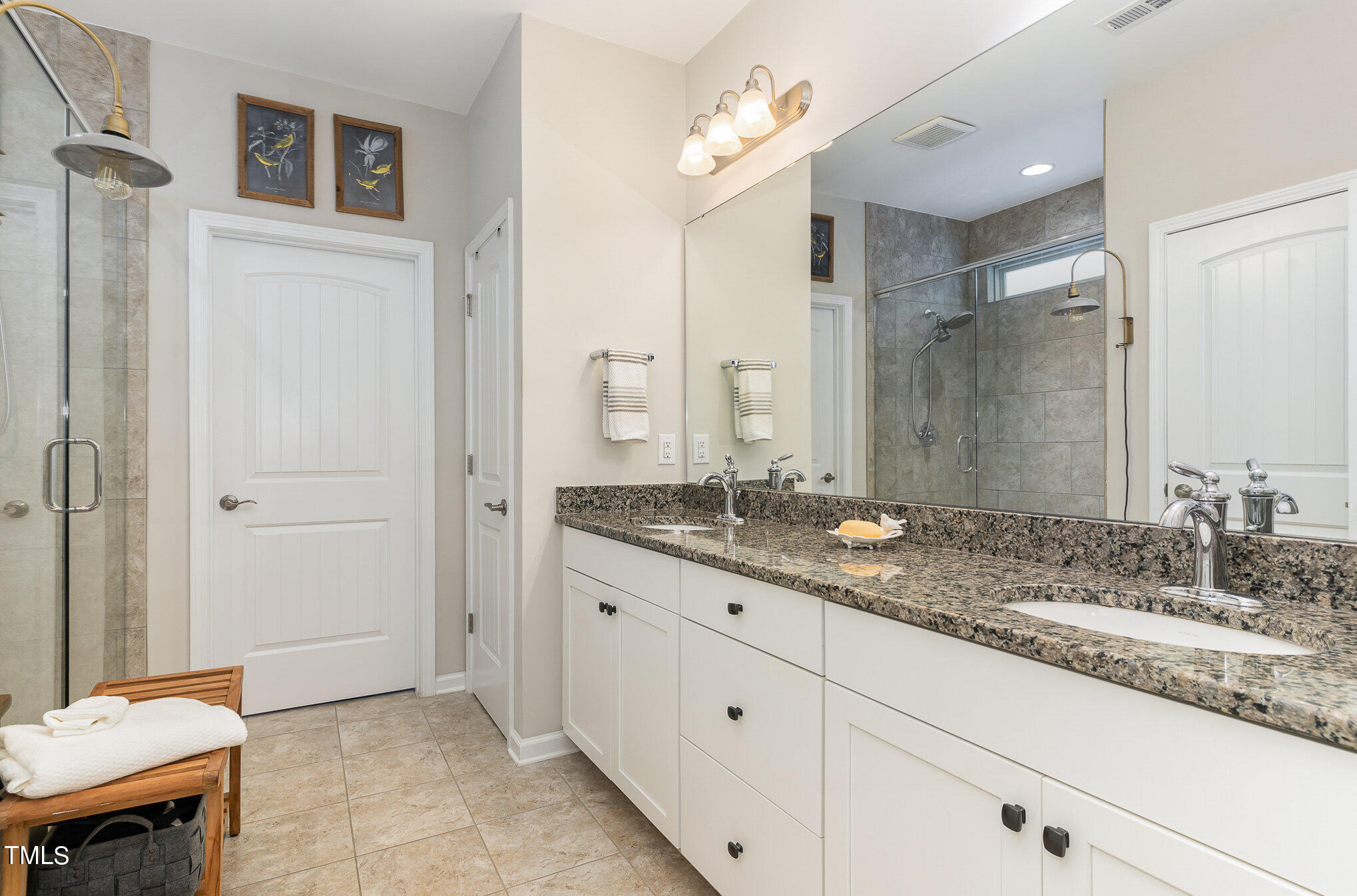 1308 Atticus Way Durham, NC 27703 - Photo 16 of 40 a bathroom with a granite countertop sink and a mirror