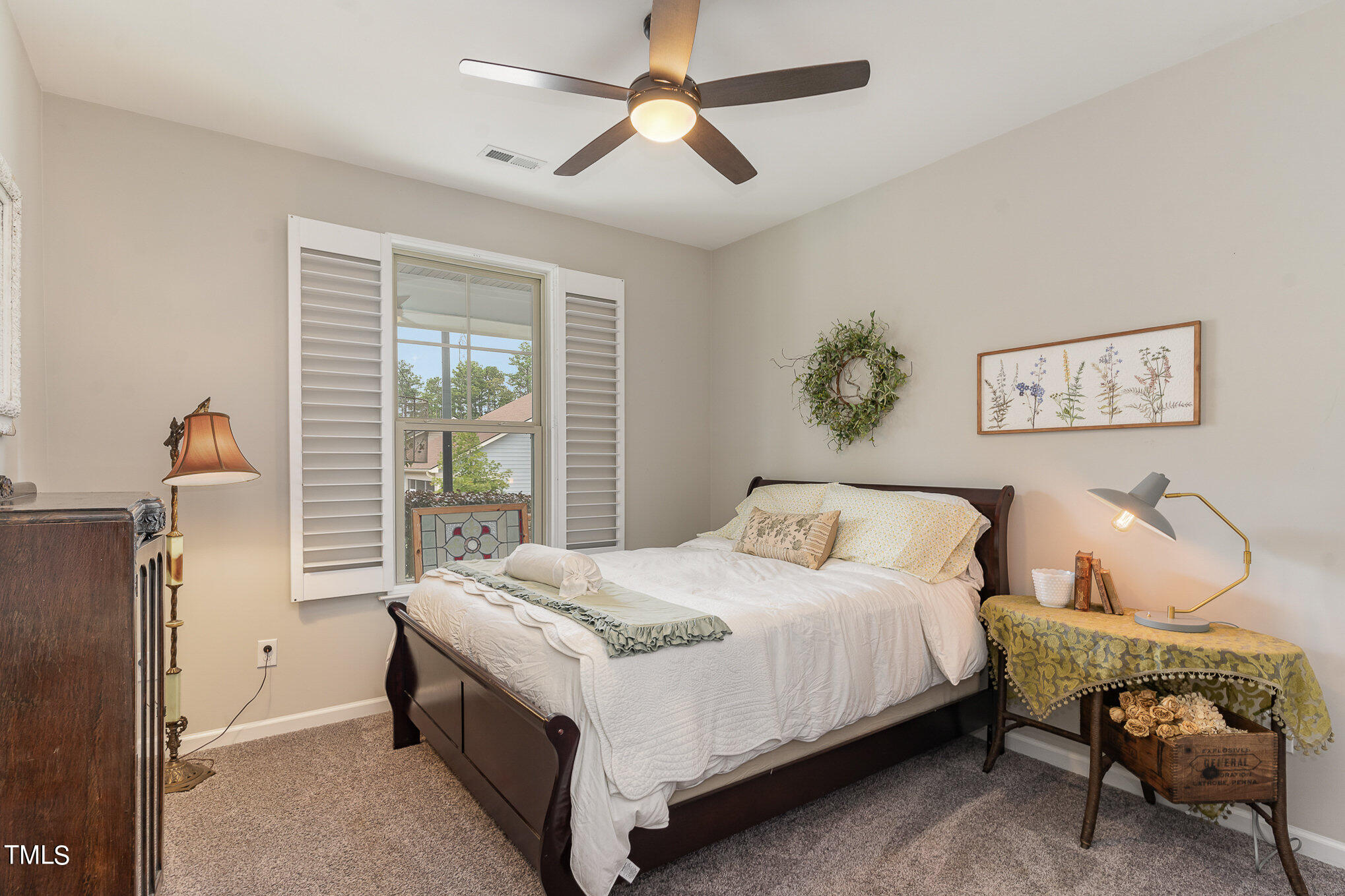 1308 Atticus Way Durham, NC 27703 - Photo 17 of 40 a bedroom with a bed and a chandelier
