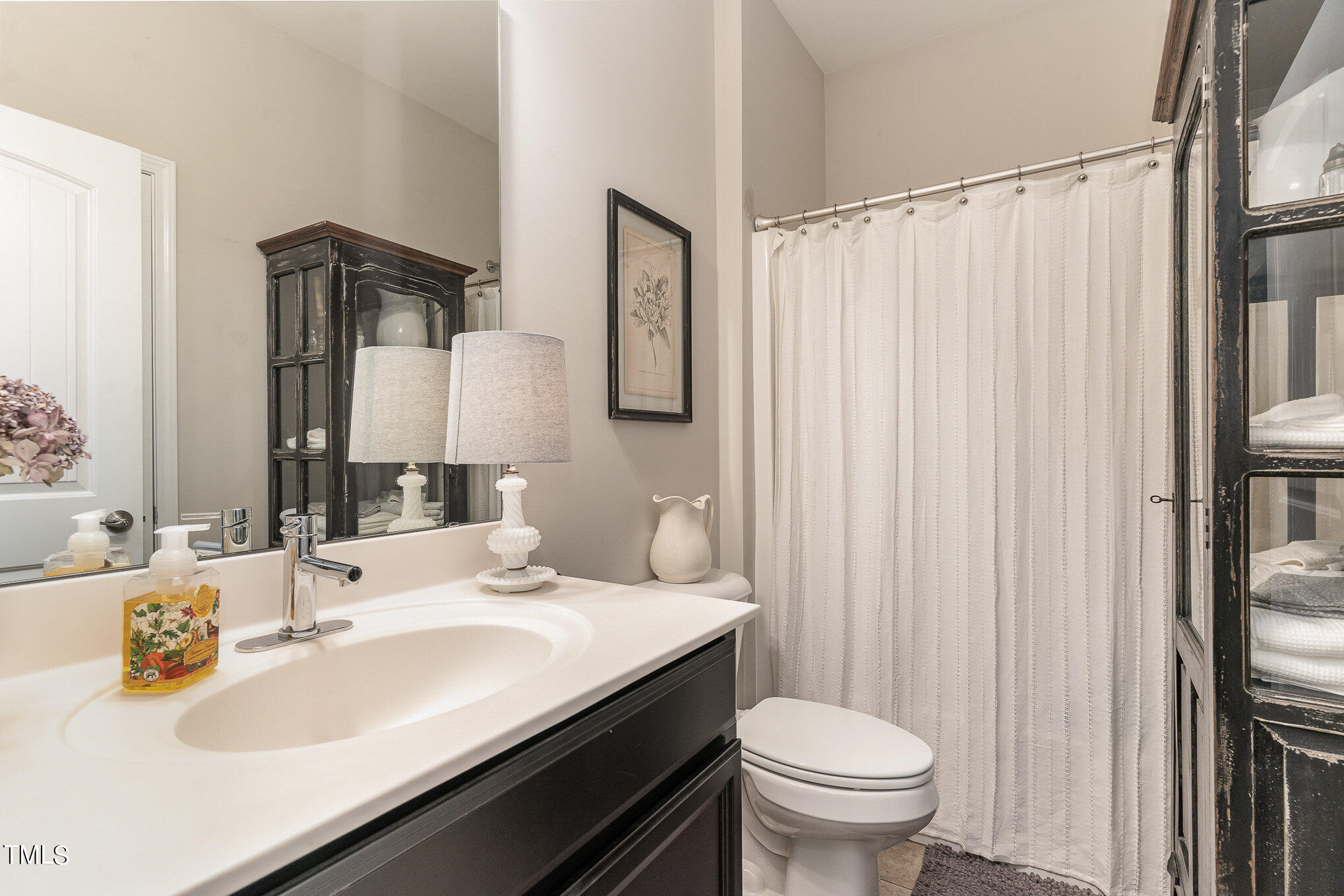 1308 Atticus Way Durham, NC 27703 - Photo 18 of 40 a bathroom with a sink toilet and shower
