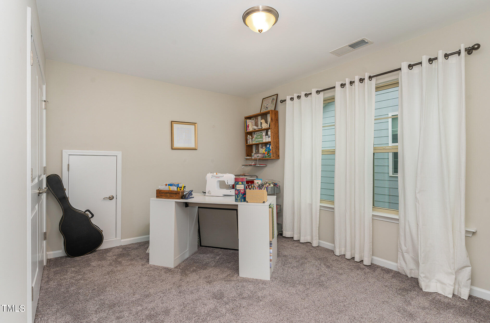 1308 Atticus Way Durham, NC 27703 - Photo 19 of 40 a view of a storage & utility room with a window