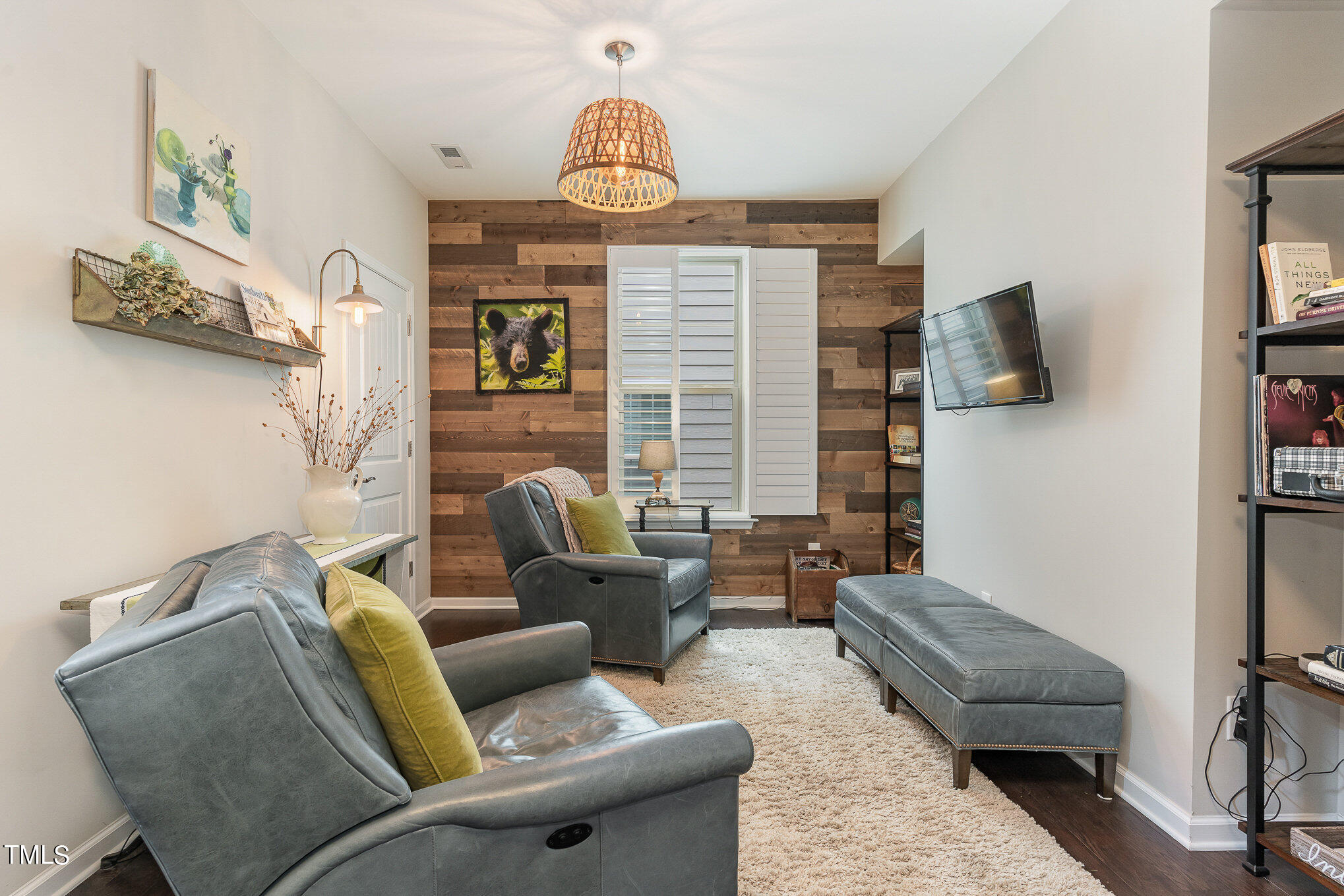 1308 Atticus Way Durham, NC 27703 - Photo 20 of 40 a living room with furniture and a flat screen tv