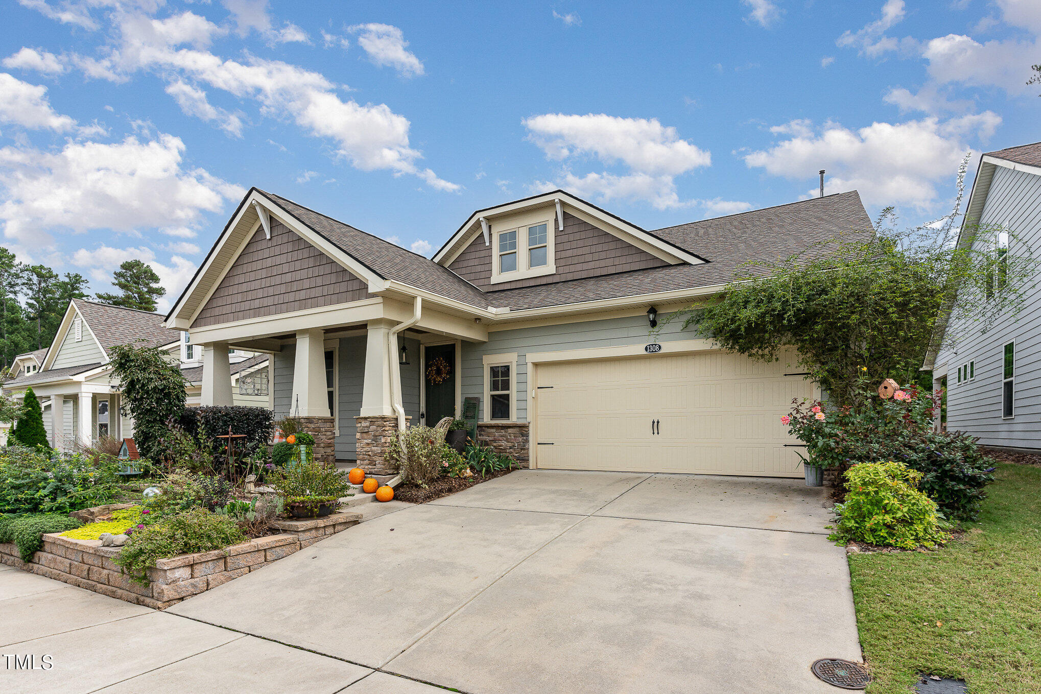 1308 Atticus Way Durham, NC 27703 - Photo 2 of 40 a front view of a house with garden