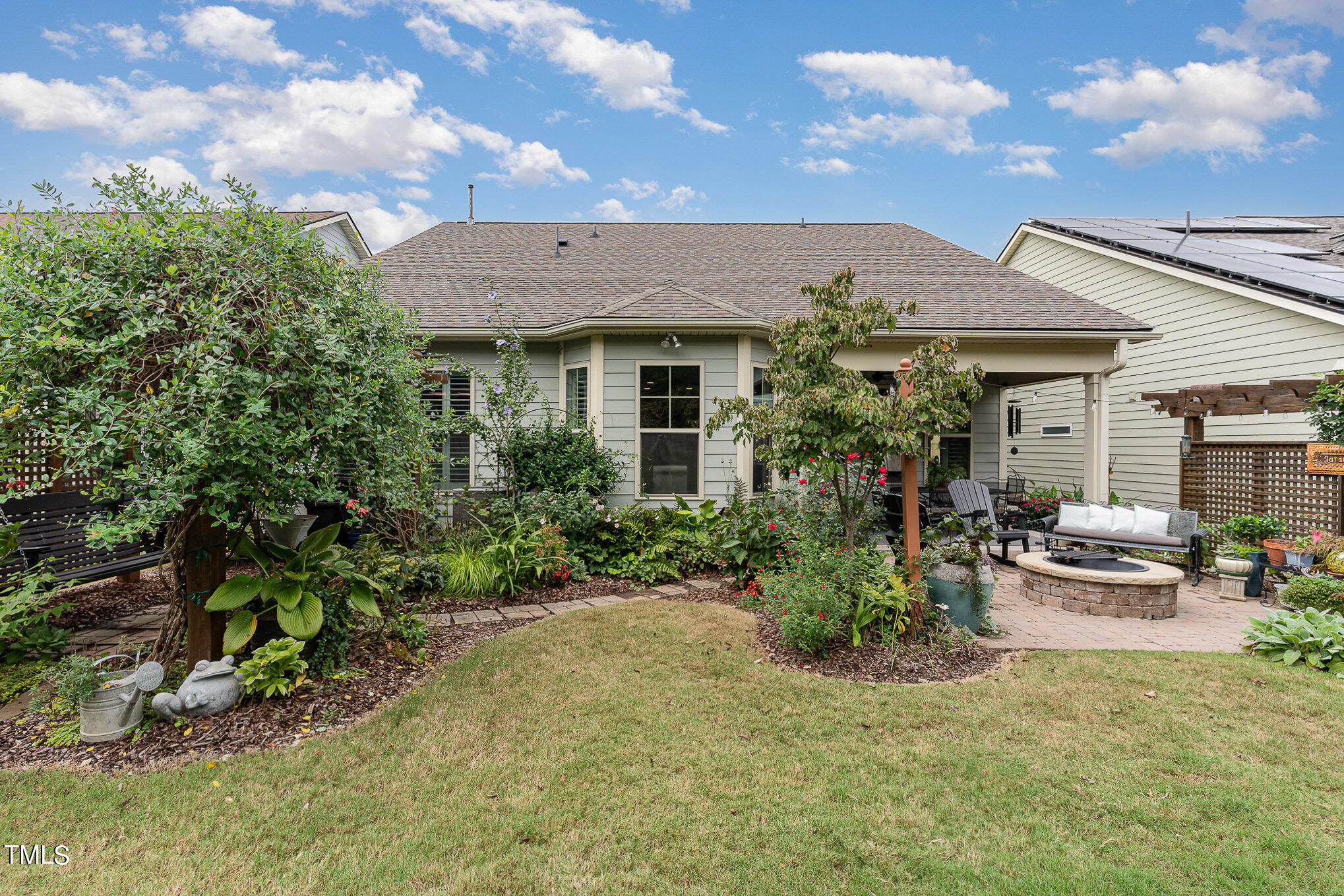 1308 Atticus Way Durham, NC 27703 - Photo 26 of 40 a front view of house with yard and trees in the background
