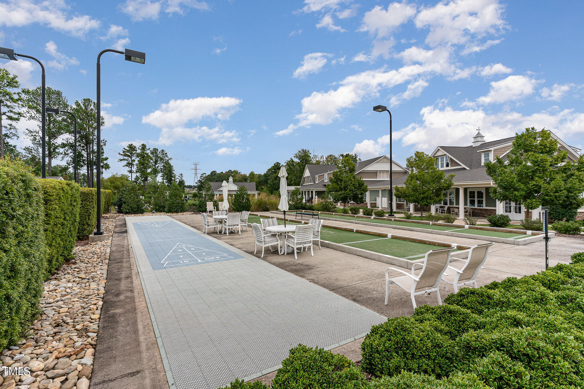 1308 Atticus Way Durham, NC 27703 - Photo 32 of 40 a view of a patio with a table and chairs