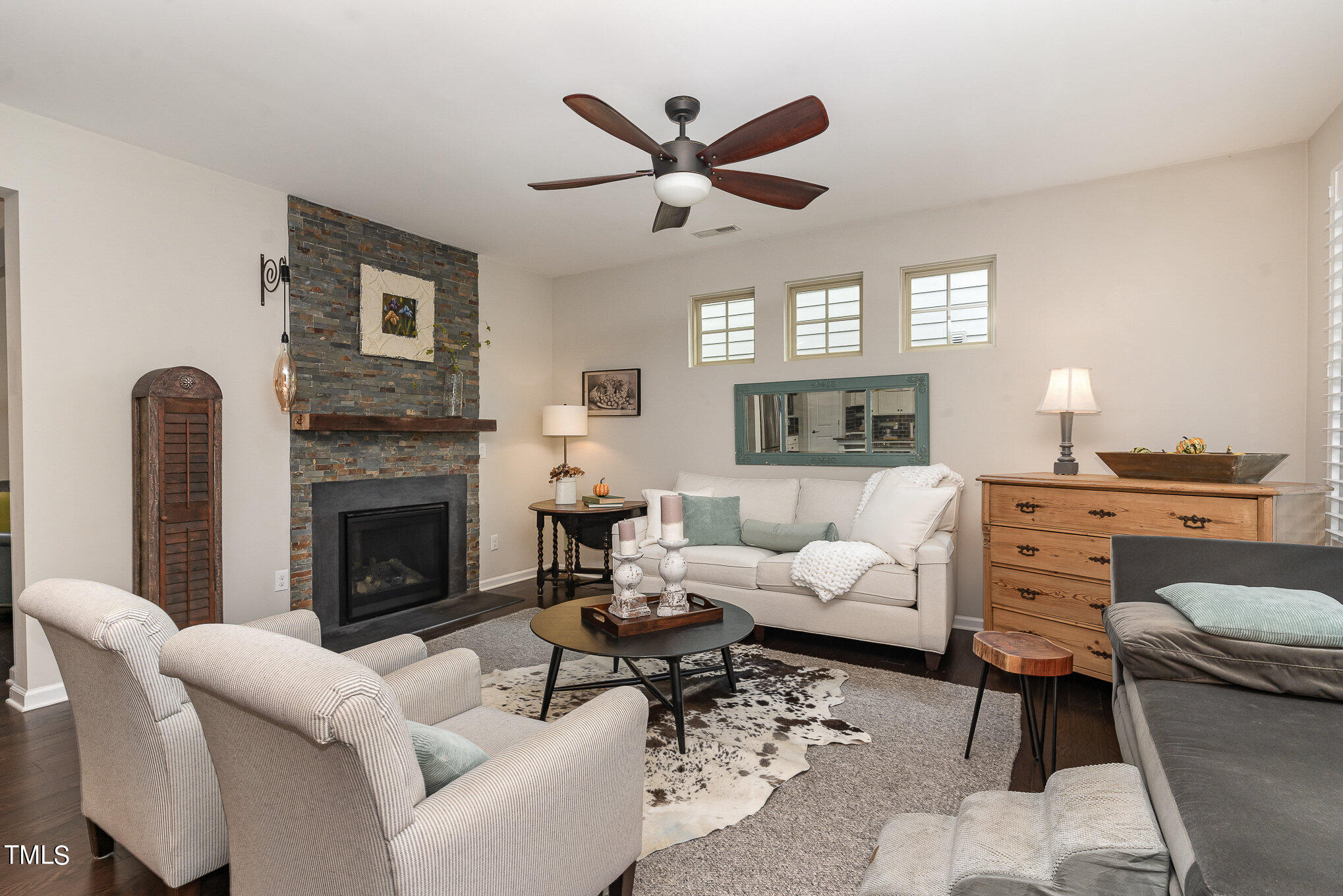 1308 Atticus Way Durham, NC 27703 - Photo 7 of 40 a living room with furniture a fireplace and a window