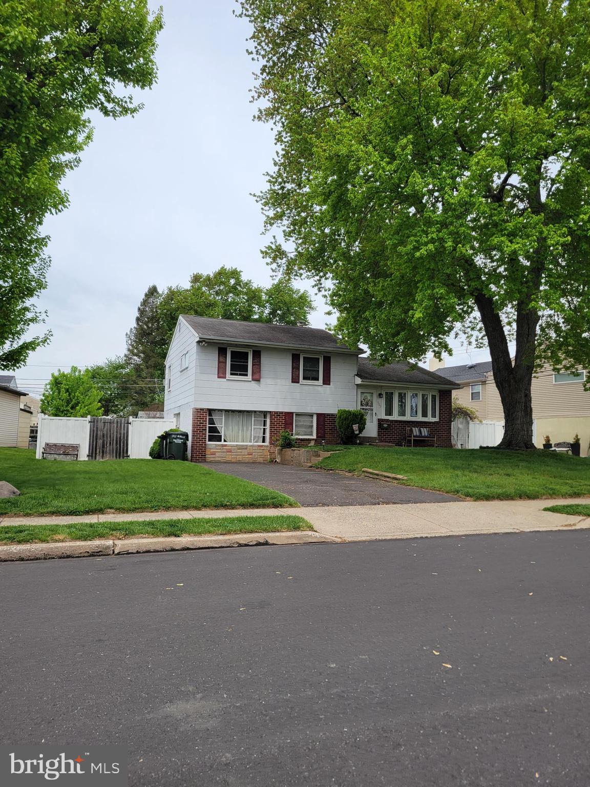 303 Willard Road Hatboro, PA 19040 - Photo 2 of 5 a front view of a house with a yard and large trees