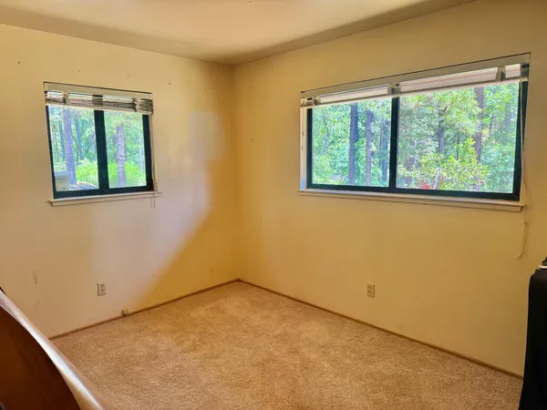 a view of a room that has a window in it