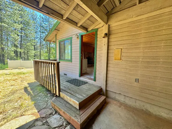 a view of backyard with cabin