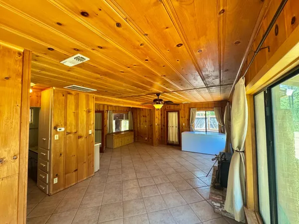 a view of a bathroom with a tub and shower