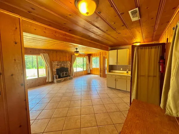 a bathroom with a sink a toilet and a shower