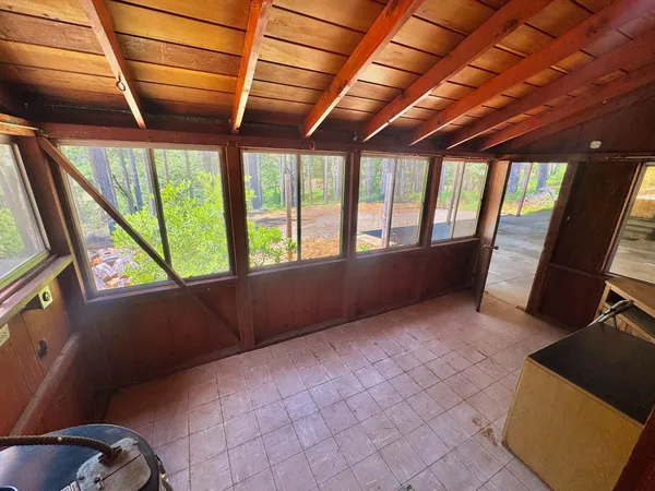 a view of an empty room with a window