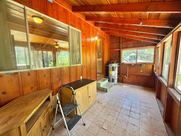 a view of a chair and table in the balcony