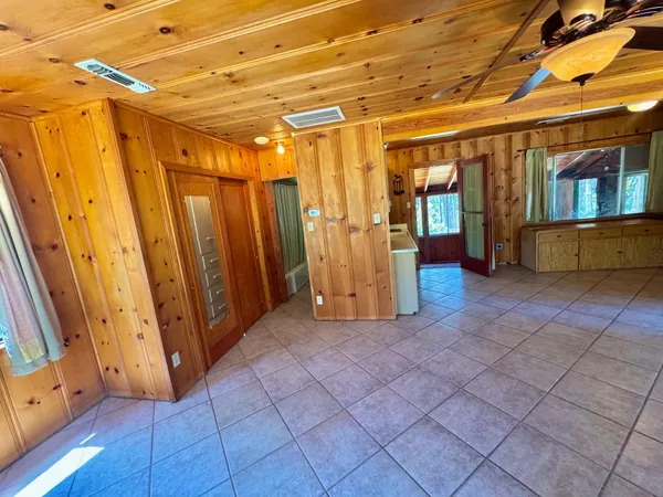 a view of a room with wooden walls