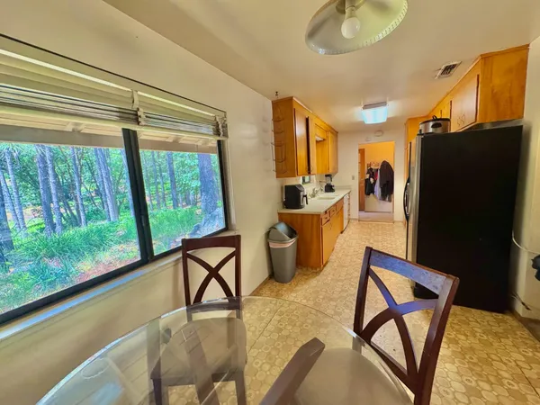 a view of a living room and dining room