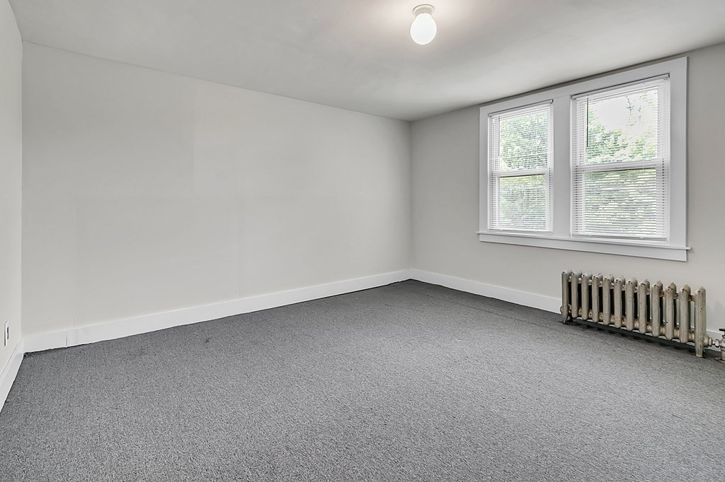 89 Sylvester Street Springfield, MA 01109 - Photo 34 of 41 an empty room with a window
