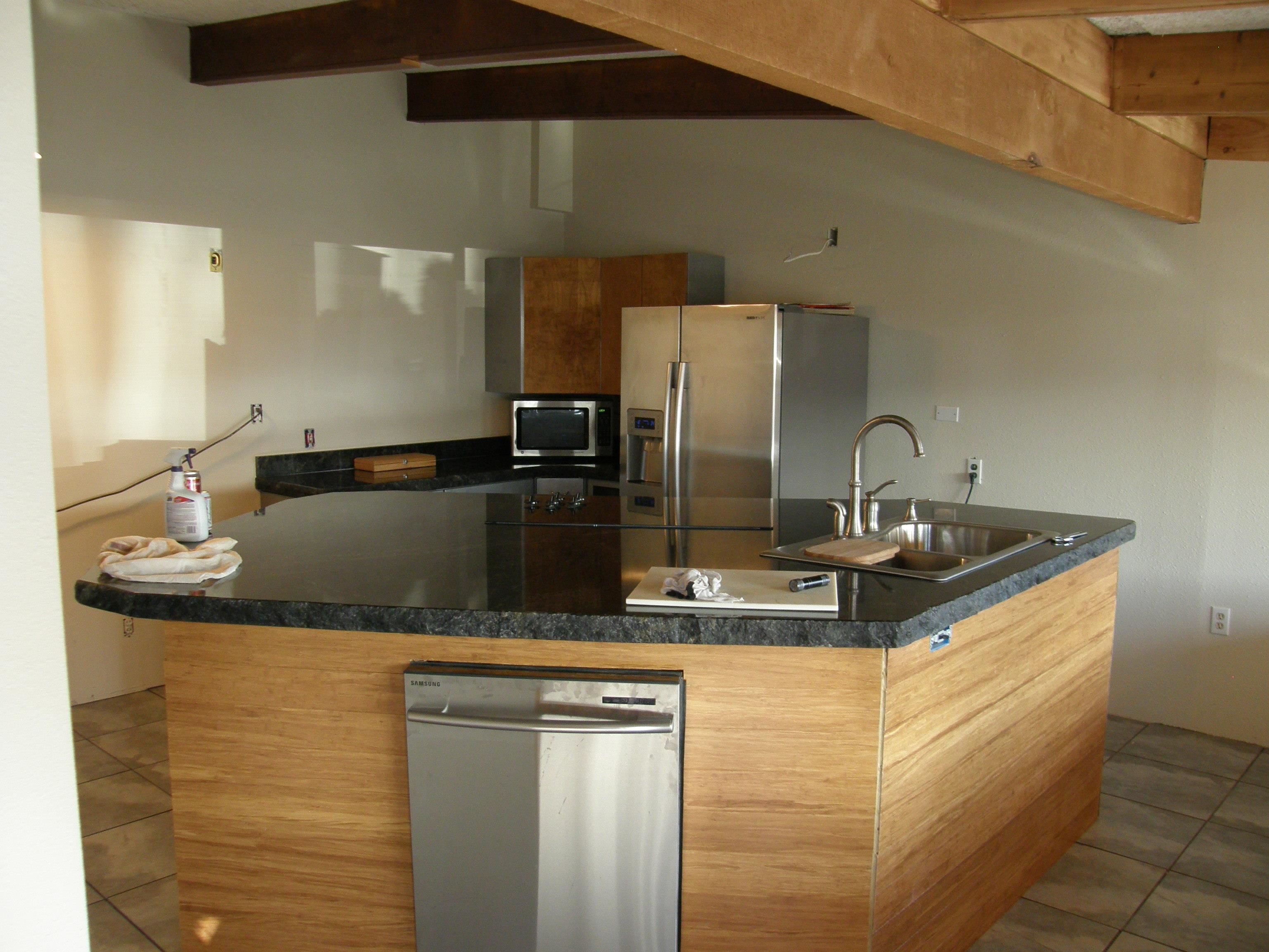 117 Easter Hill Drive Grand Junction, CO 81507 - Photo 2 of 21 a kitchen with granite countertop a sink and cabinets