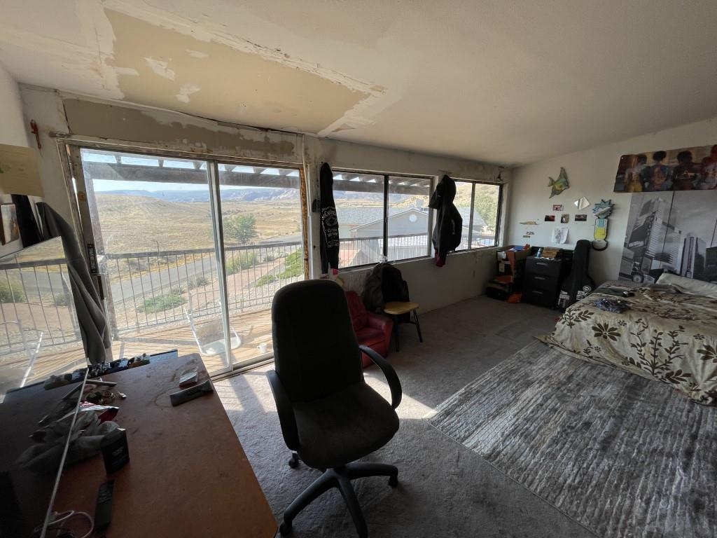 117 Easter Hill Drive Grand Junction, CO 81507 - Photo 4 of 21 a living room with furniture and a large window
