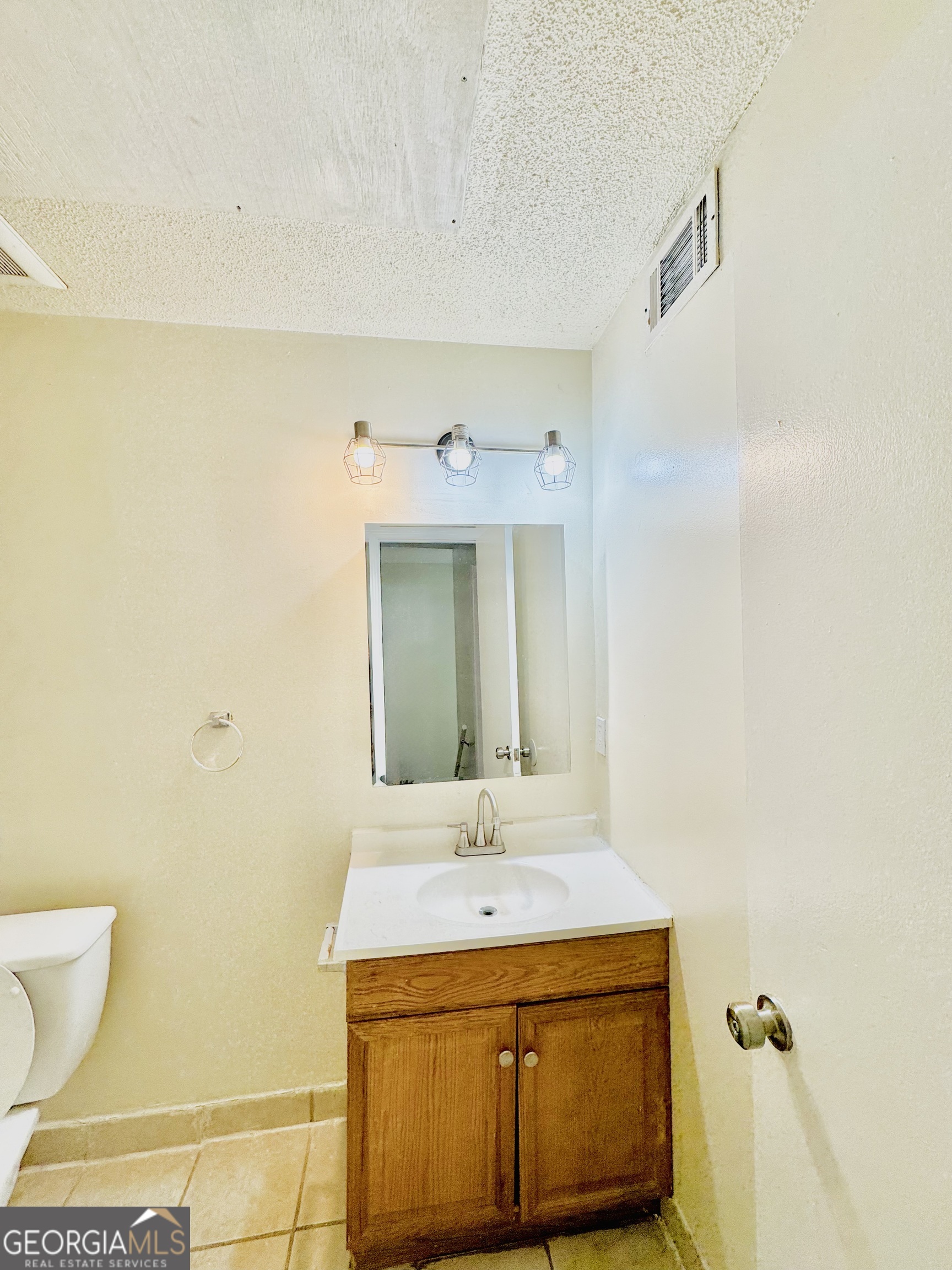 4755 Yates Road, Unit 4A College Park, GA 30337 - Photo 12 of 15 a bathroom with a sink and a mirror