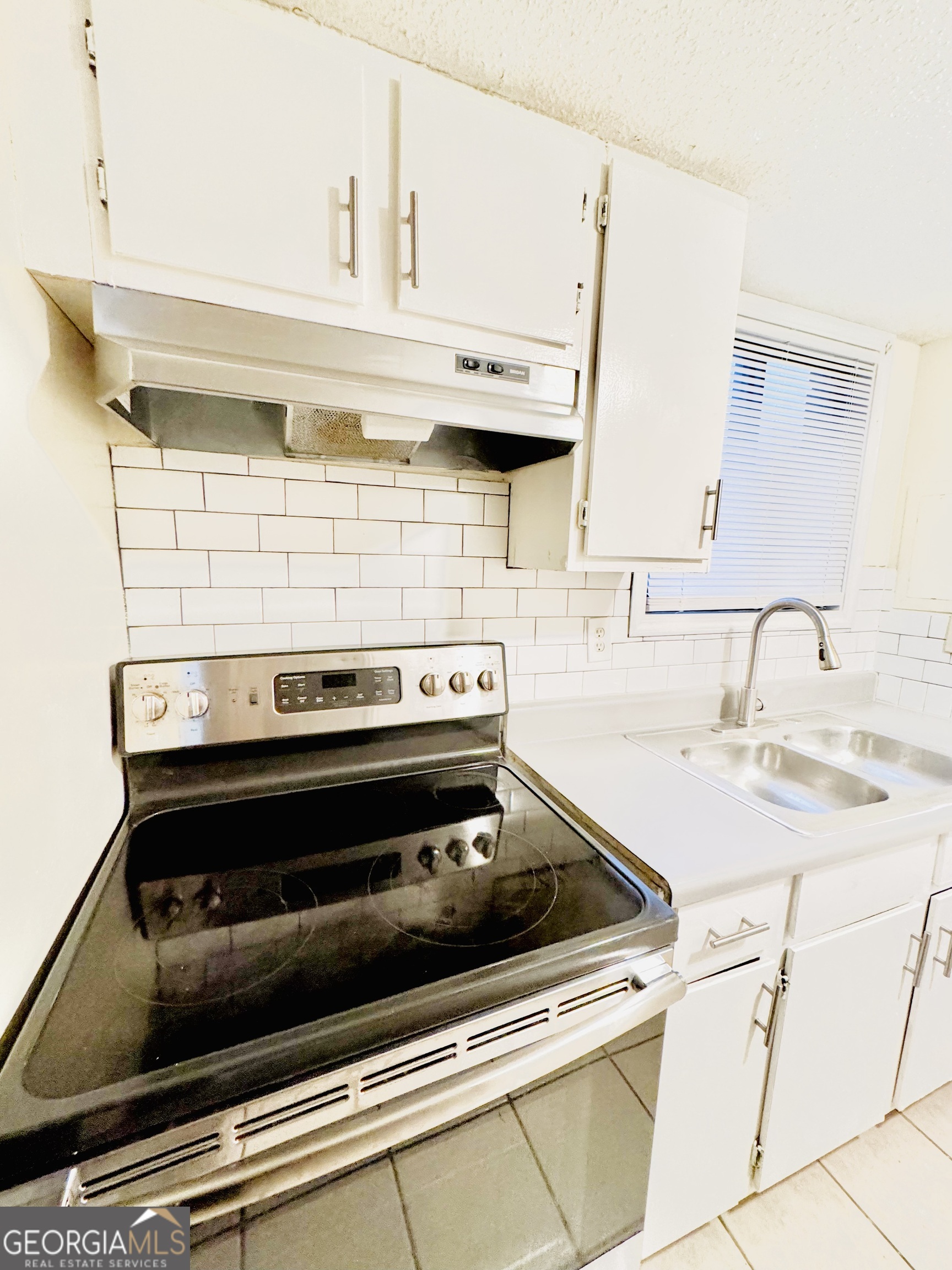 4755 Yates Road, Unit 4A College Park, GA 30337 - Photo 4 of 15 a close view of a stove a sink and dishwasher