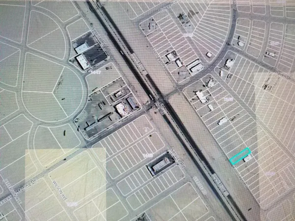 an aerial view of a multi story parking space