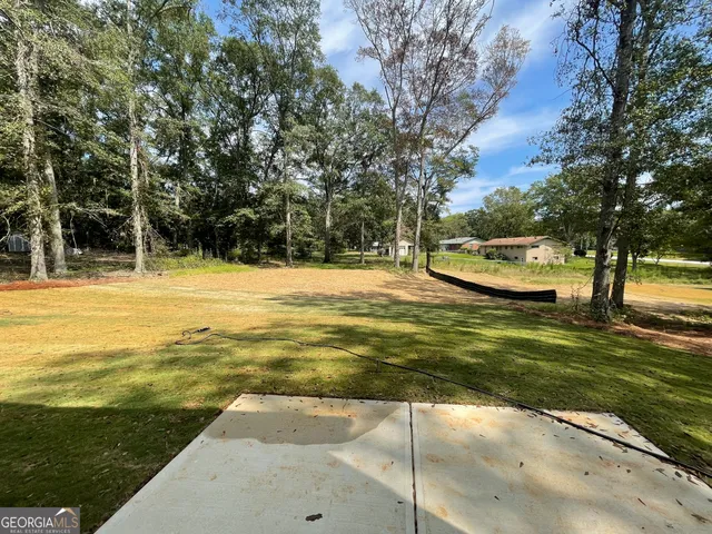 a view of a swimming pool with an outdoor space