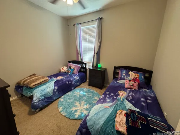 a bedroom with bed and a window