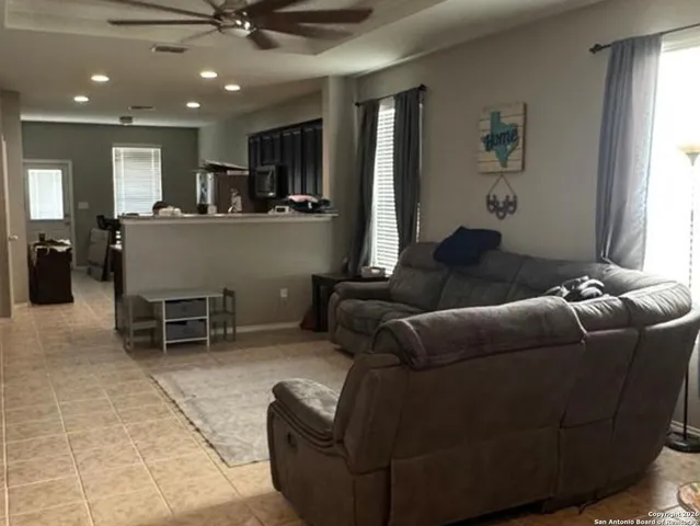 a living room with furniture and a window