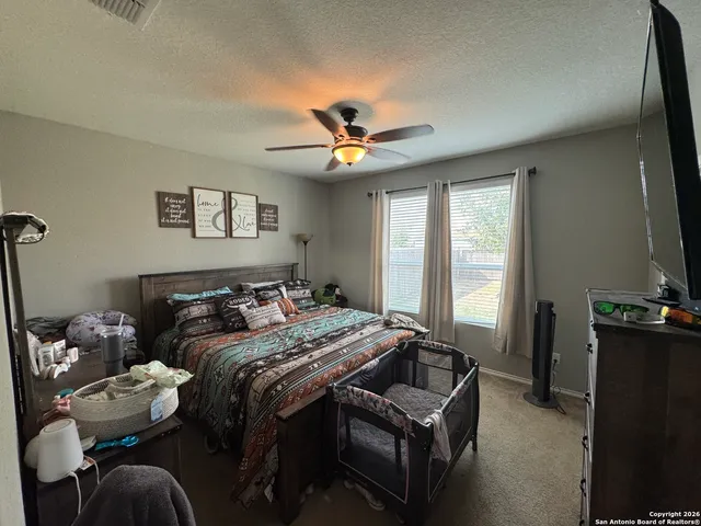 a bedroom with bed or furniture and a chandelier