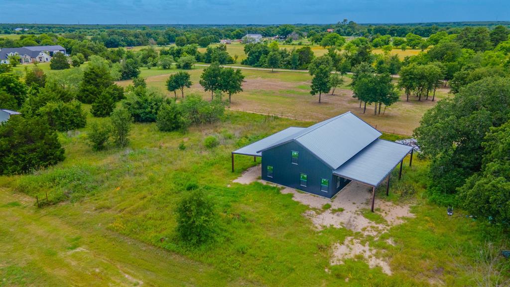 Tbd Wiggins Road West, TX 76691 - Photo 7 of 11 Barn-style residence featuring a metal roof and dark-toned siding