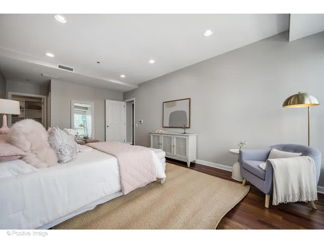 a bedroom with a bed and a couch