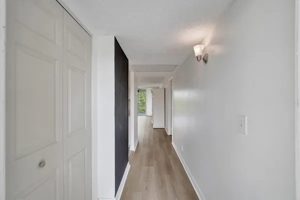 a kitchen with white cabinets appliances and a sink