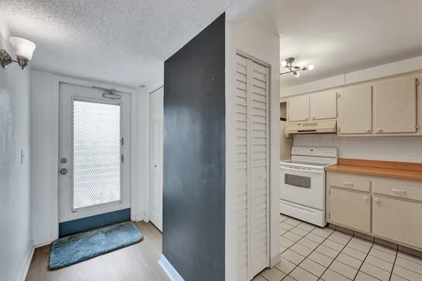 a kitchen with a sink window and cabinets