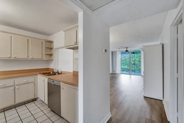 a kitchen with stainless steel appliances granite countertop a sink and cabinets