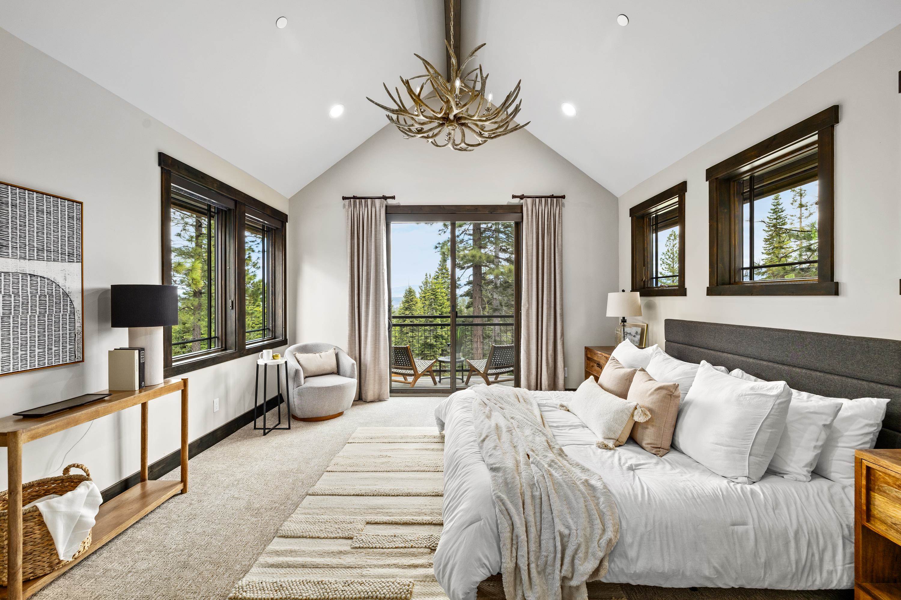 9355 Nine Bark Road Truckee, CA 96161 - Photo 14 of 21 a bedroom with a large bed and windows