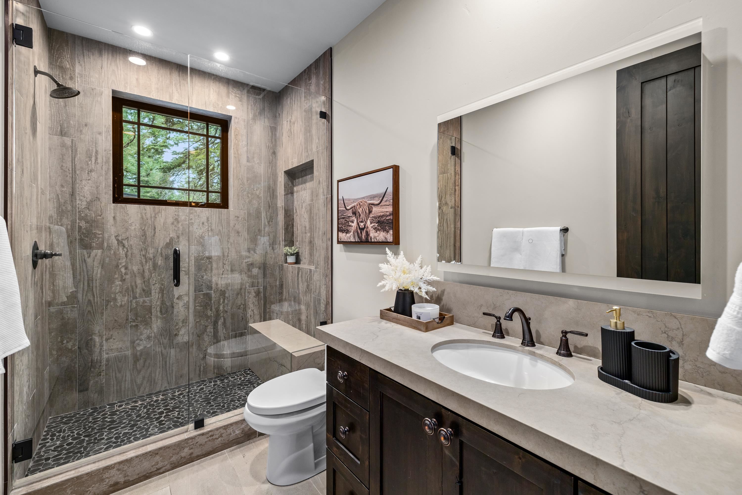 9355 Nine Bark Road Truckee, CA 96161 - Photo 15 of 21 a bathroom with a granite countertop sink toilet and shower