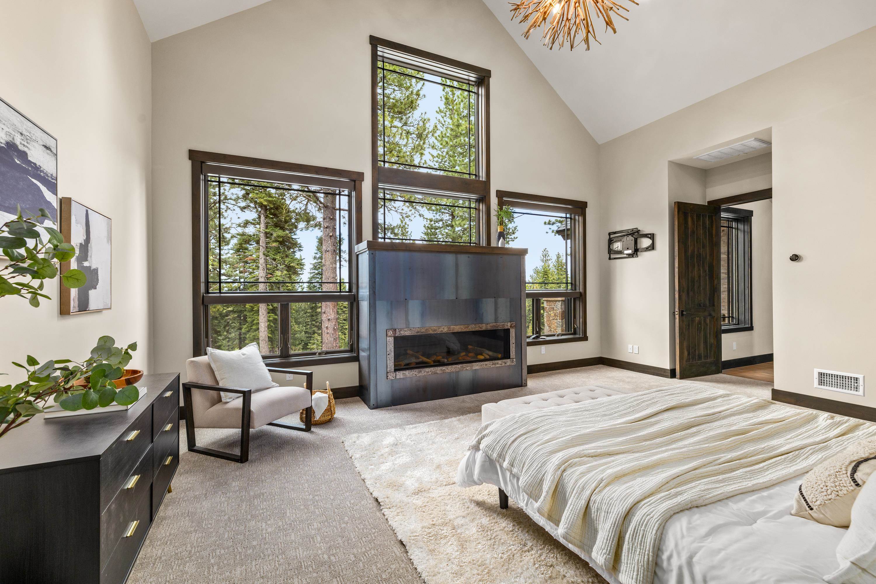 9355 Nine Bark Road Truckee, CA 96161 - Photo 17 of 21 a bedroom with a bed couch and a large window