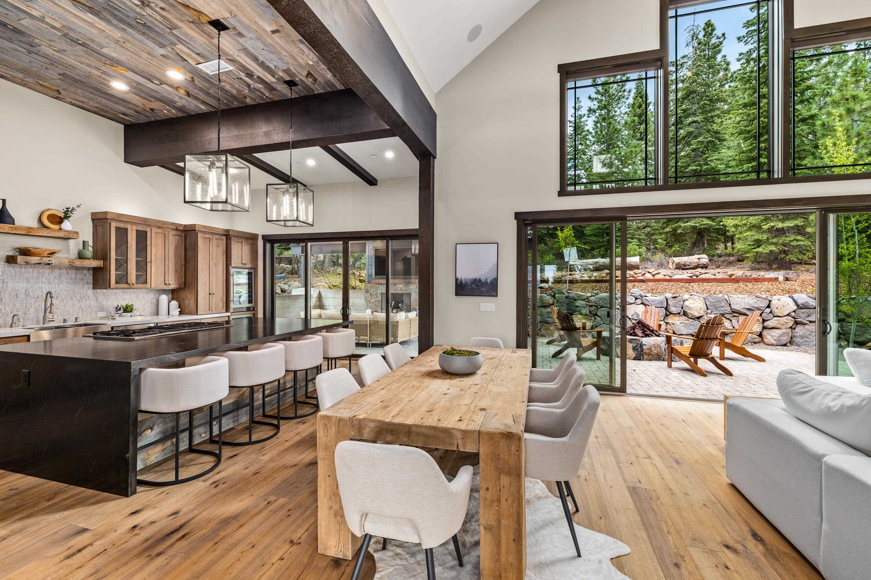 9355 Nine Bark Road Truckee, CA 96161 - Photo 4 of 21 a dining room with wooden floor and large windows