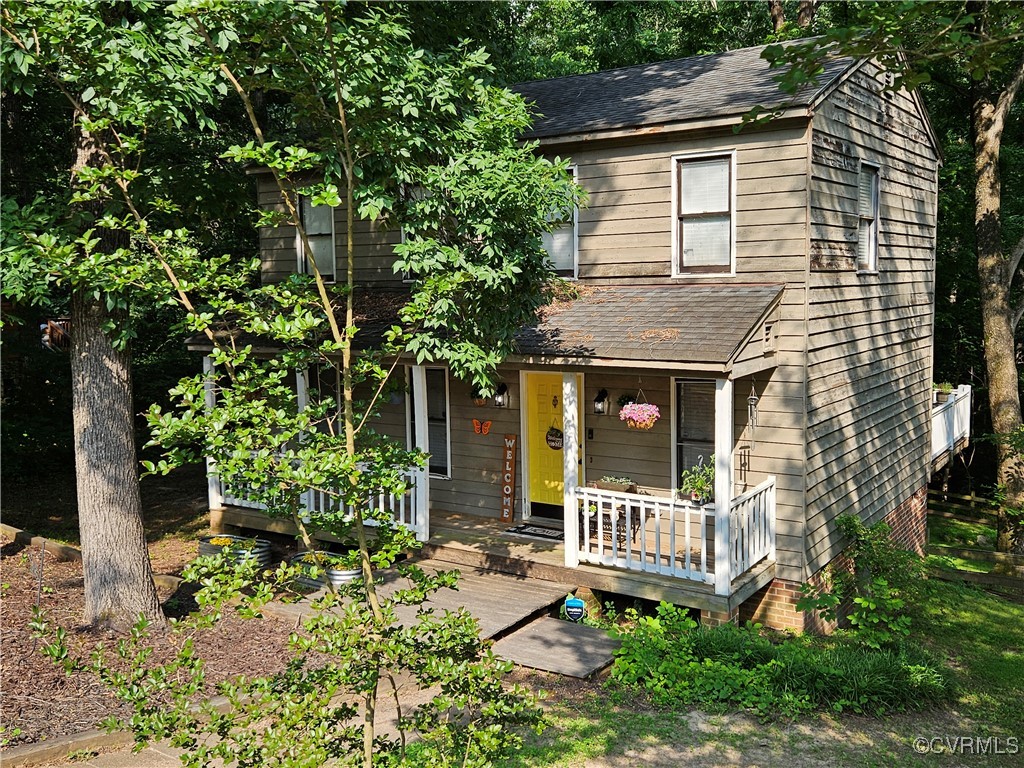 7106 Full Rack Drive Midlothian, VA 23112 - Photo 3 of 26 a view of a house with a yard and plants
