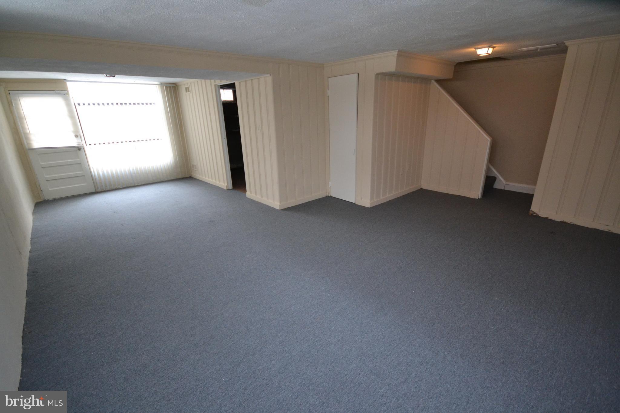7122 Boxford Road Baltimore, MD 21215 - Photo 12 of 14 an empty room with windows and closet