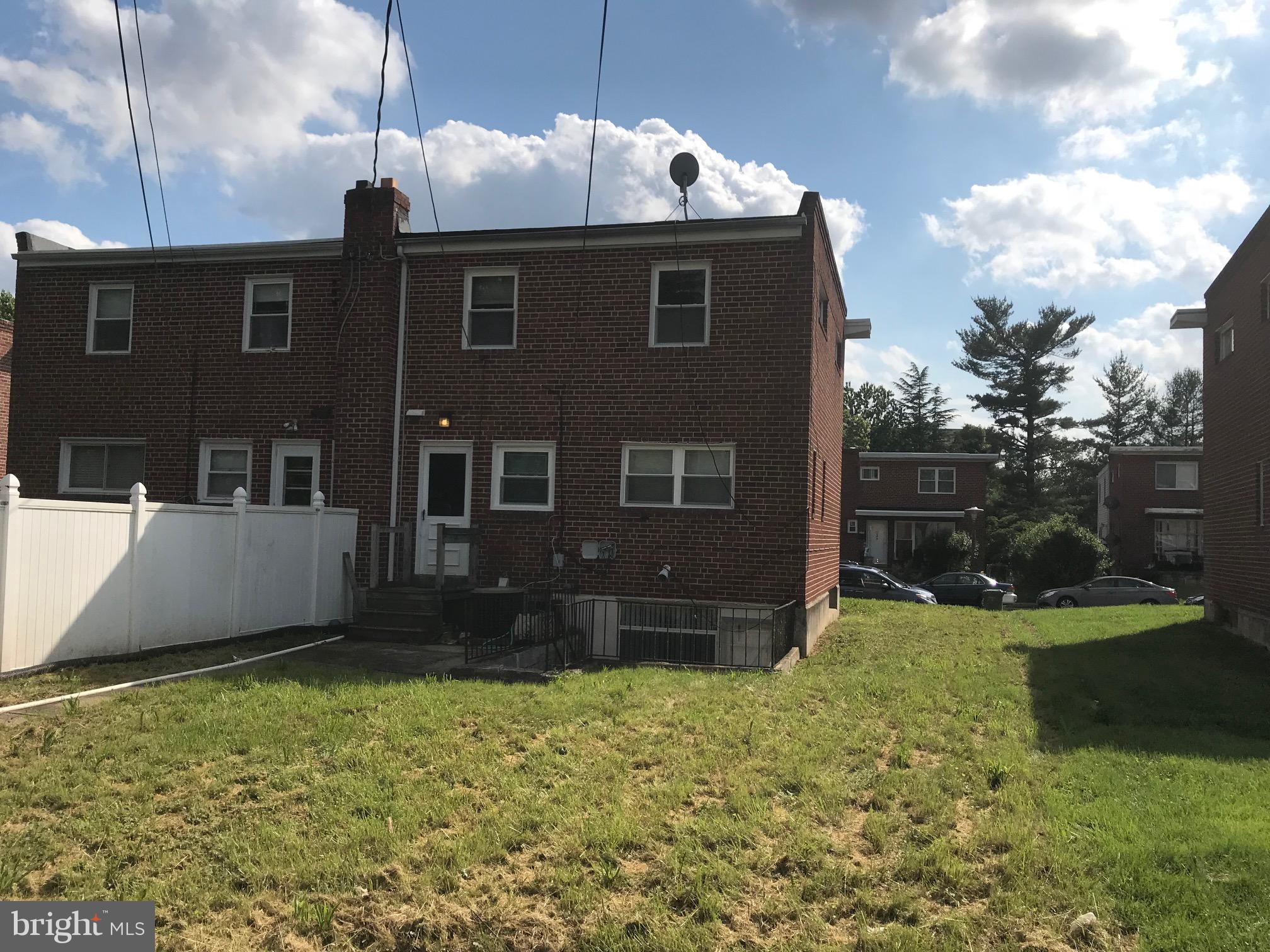 7122 Boxford Road Baltimore, MD 21215 - Photo 14 of 14 front view of a house with a yard