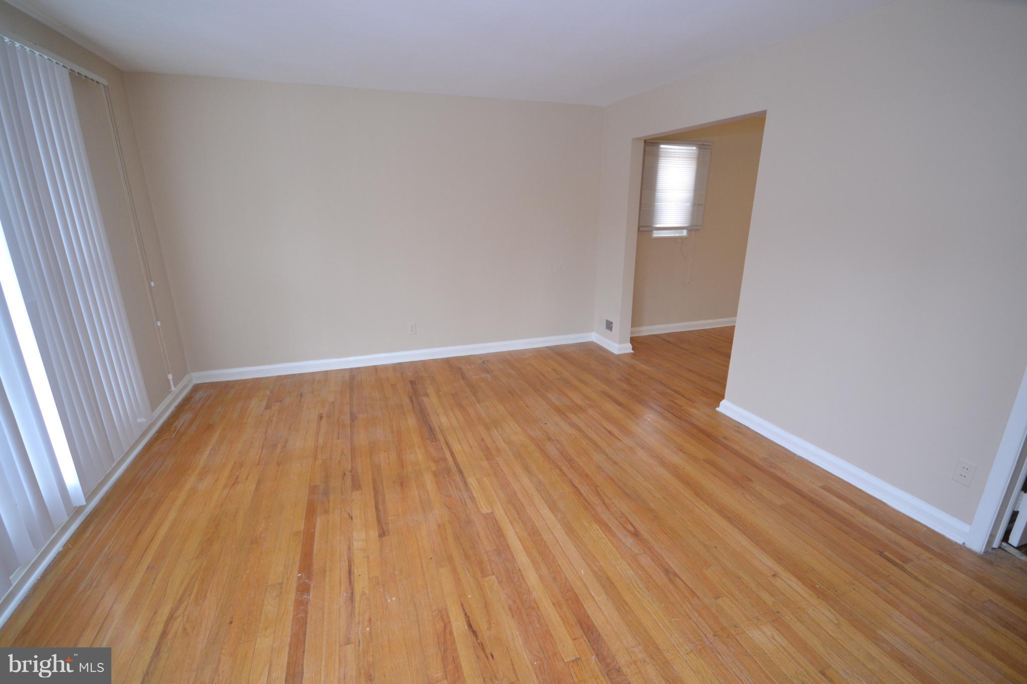 7122 Boxford Road Baltimore, MD 21215 - Photo 3 of 14 a view of wooden floor in a room