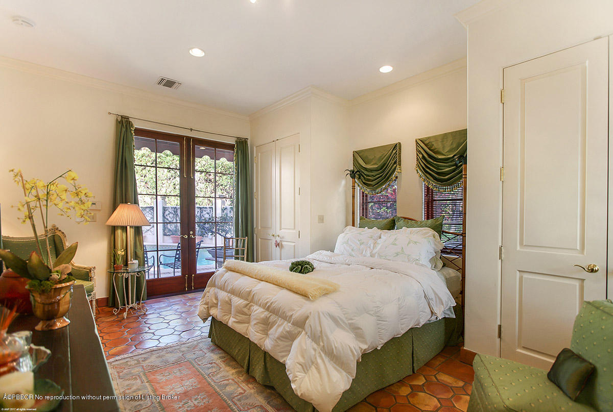 1 Golfview Road Palm Beach, FL 33480 - Photo 21 of 38 a bedroom with a bed and wooden floor