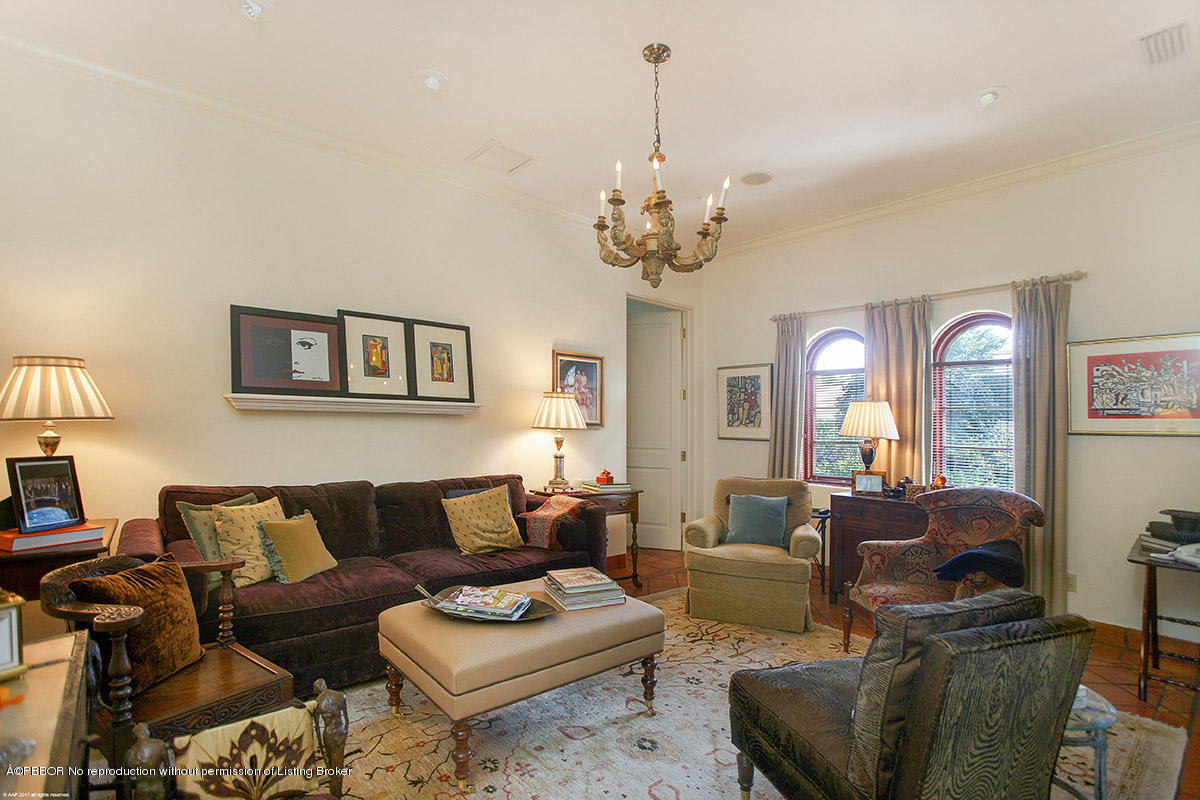 1 Golfview Road Palm Beach, FL 33480 - Photo 27 of 38 a living room with furniture and a chandelier