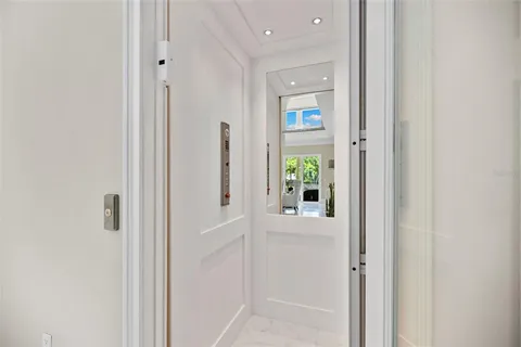 a house with swimming pool in front of it