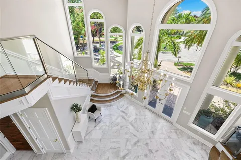 a swimming pool with outdoor seating and yard